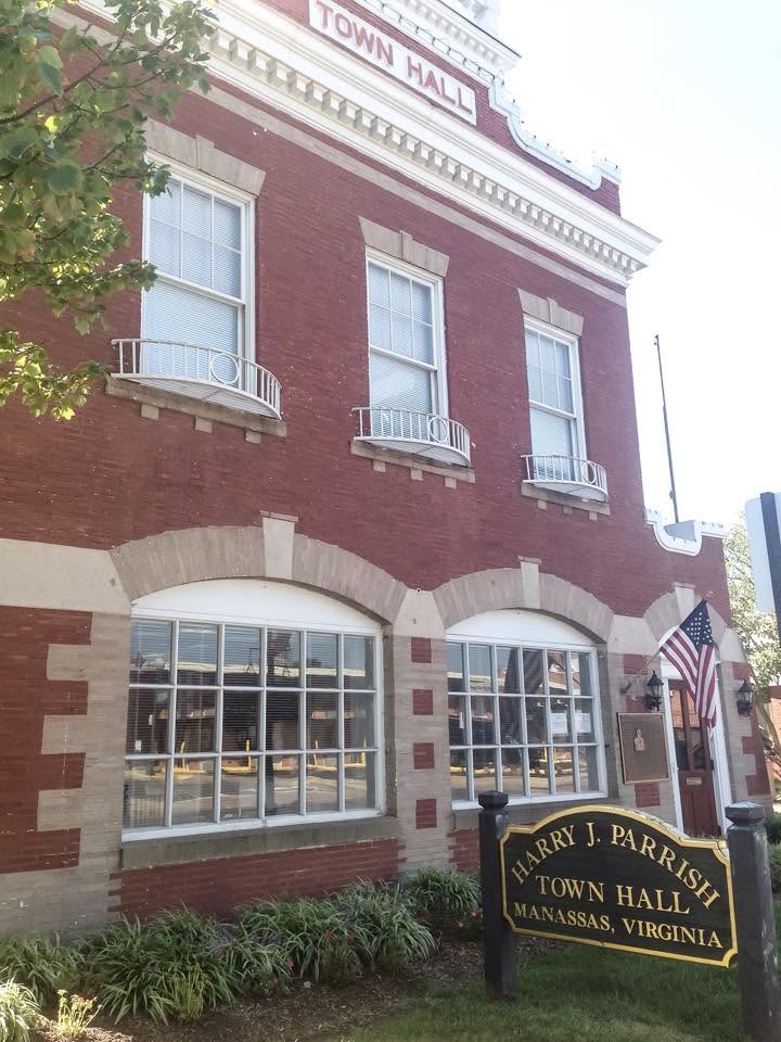 Historic brick municipal building with an American flag