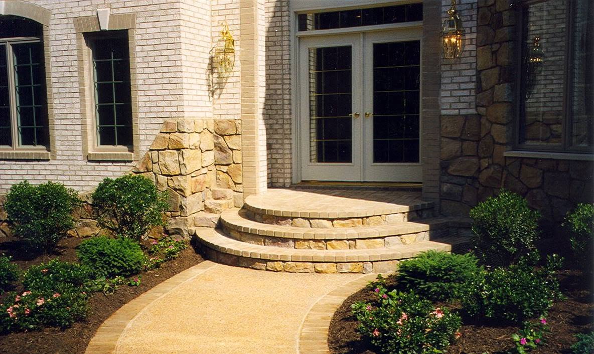 Natural stone steps and entry columns on a residential home